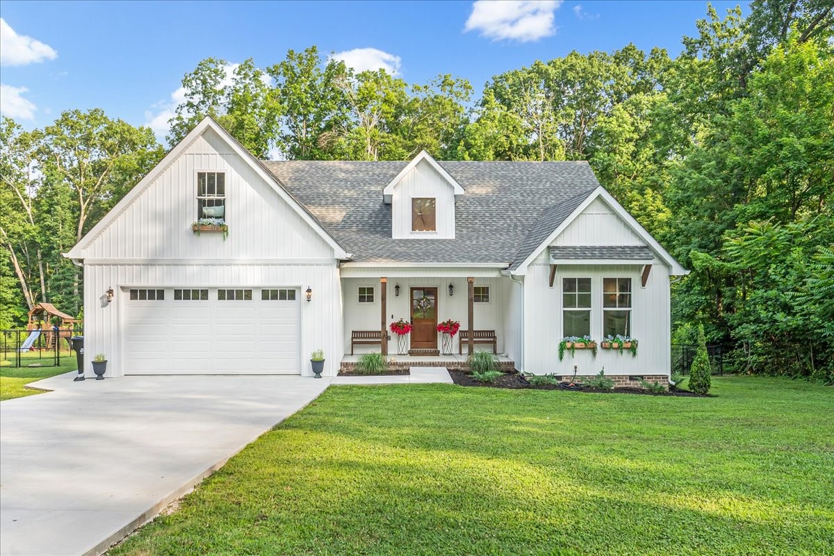 768 Laurel Crown Road Manchester, TN 37355 - Photo 2 of 63 a front view of a house with a yard and trees