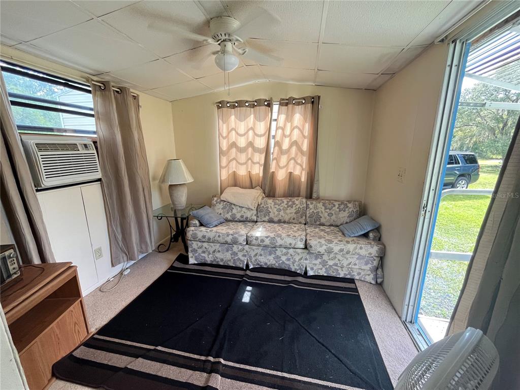 820 Chicken Farm Road Osteen, FL 32764 - Photo 13 of 30 a living room with furniture and a window
