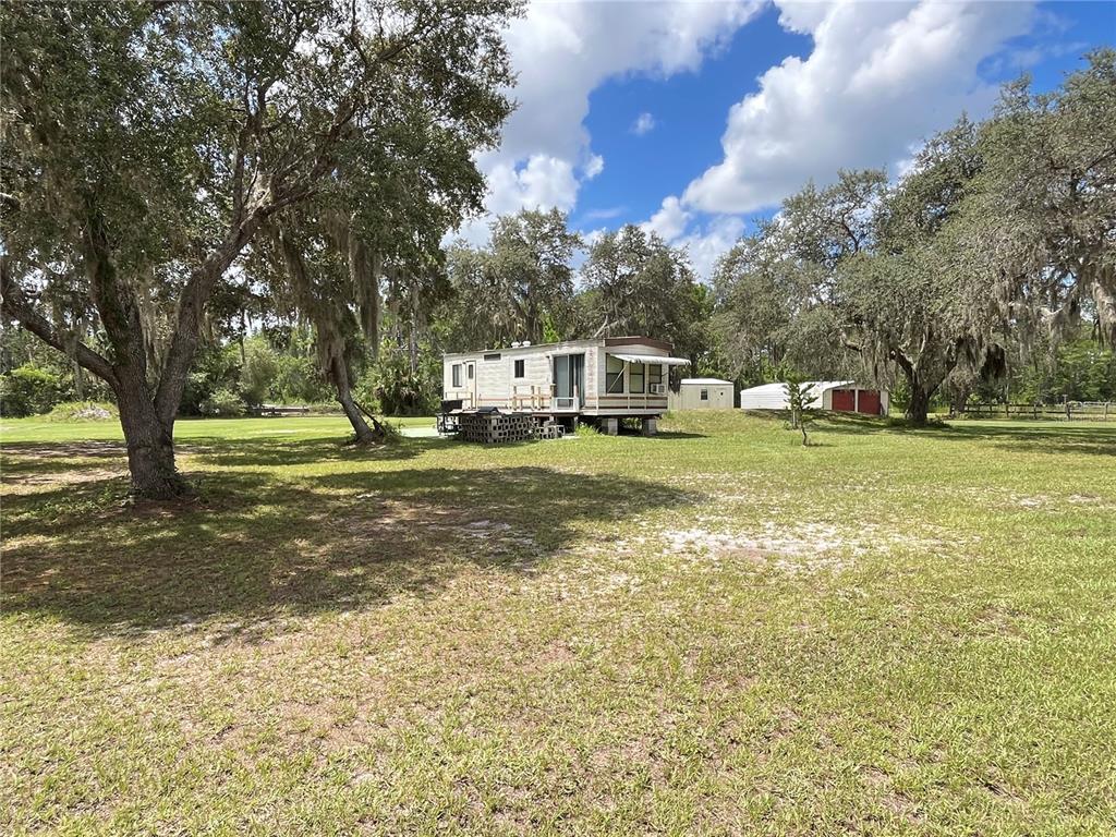 820 Chicken Farm Road Osteen, FL 32764 - Photo 14 of 30 a view of a large body of water with a building in the background