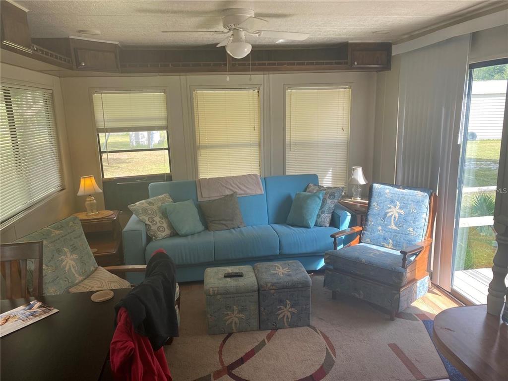 820 Chicken Farm Road Osteen, FL 32764 - Photo 15 of 30 a living room with furniture and a large window