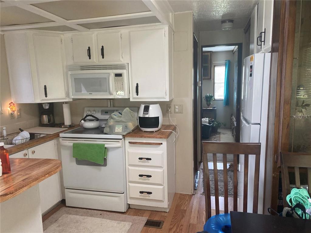 820 Chicken Farm Road Osteen, FL 32764 - Photo 16 of 30 a kitchen with cabinets and window