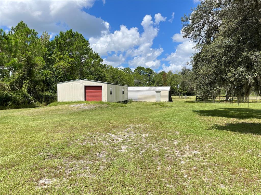 820 Chicken Farm Road Osteen, FL 32764 - Photo 18 of 30 a view of a big yard with large trees