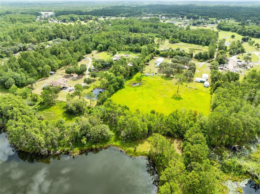 820 Chicken Farm Road Osteen, FL 32764 - Photo 2 of 30 a view of a garden with an ocean