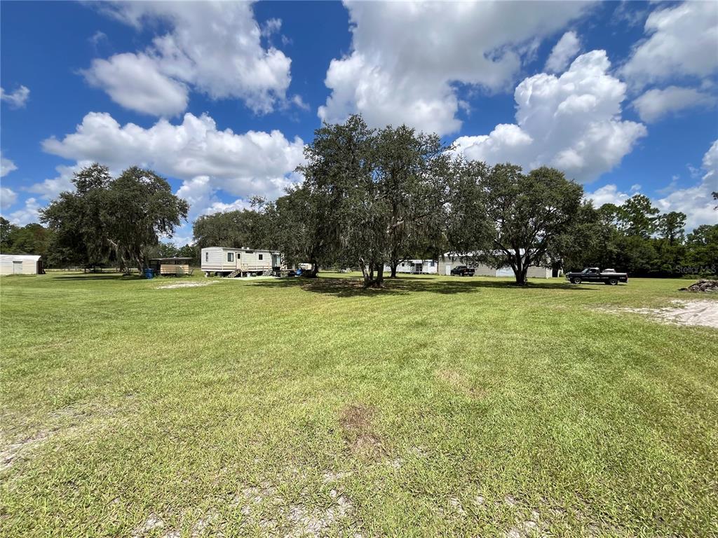 820 Chicken Farm Road Osteen, FL 32764 - Photo 25 of 30 a view of a green field