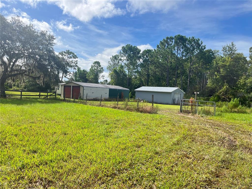 820 Chicken Farm Road Osteen, FL 32764 - Photo 29 of 30 a swimming pool with trees in the background