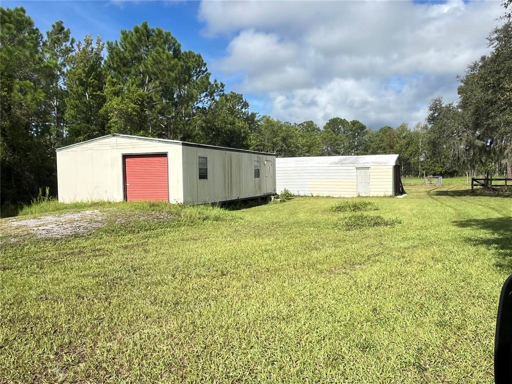 820 Chicken Farm Road Osteen, FL 32764 - Photo 30 of 30 a front view of a house with a yard and trees
