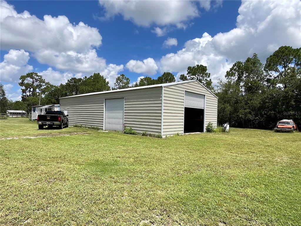 820 Chicken Farm Road Osteen, FL 32764 - Photo 3 of 30 a view of a house with a backyard