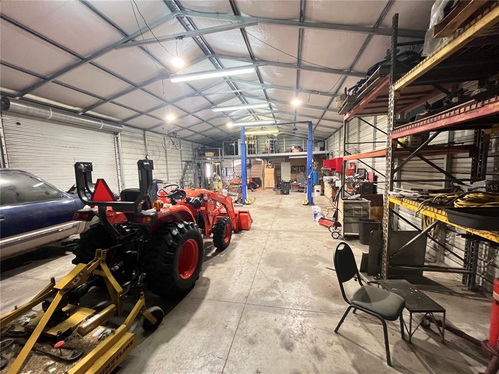 820 Chicken Farm Road Osteen, FL 32764 - Photo 6 of 30 a view of a room with gym equipment