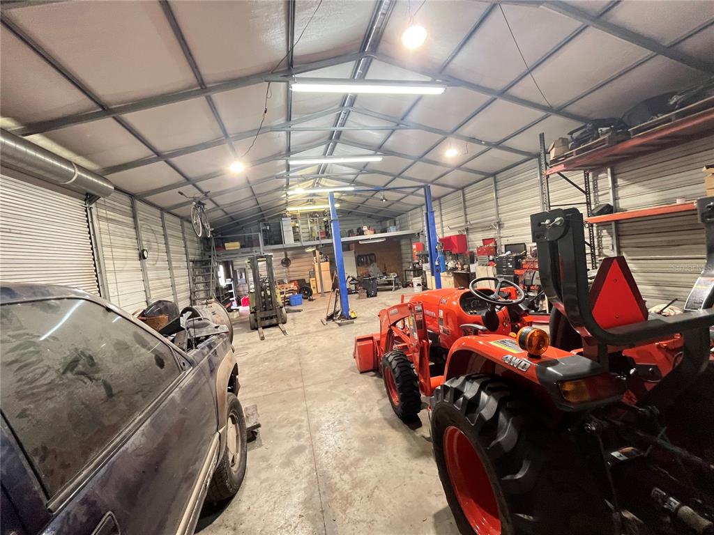 820 Chicken Farm Road Osteen, FL 32764 - Photo 7 of 30 a view of parking garage with cars