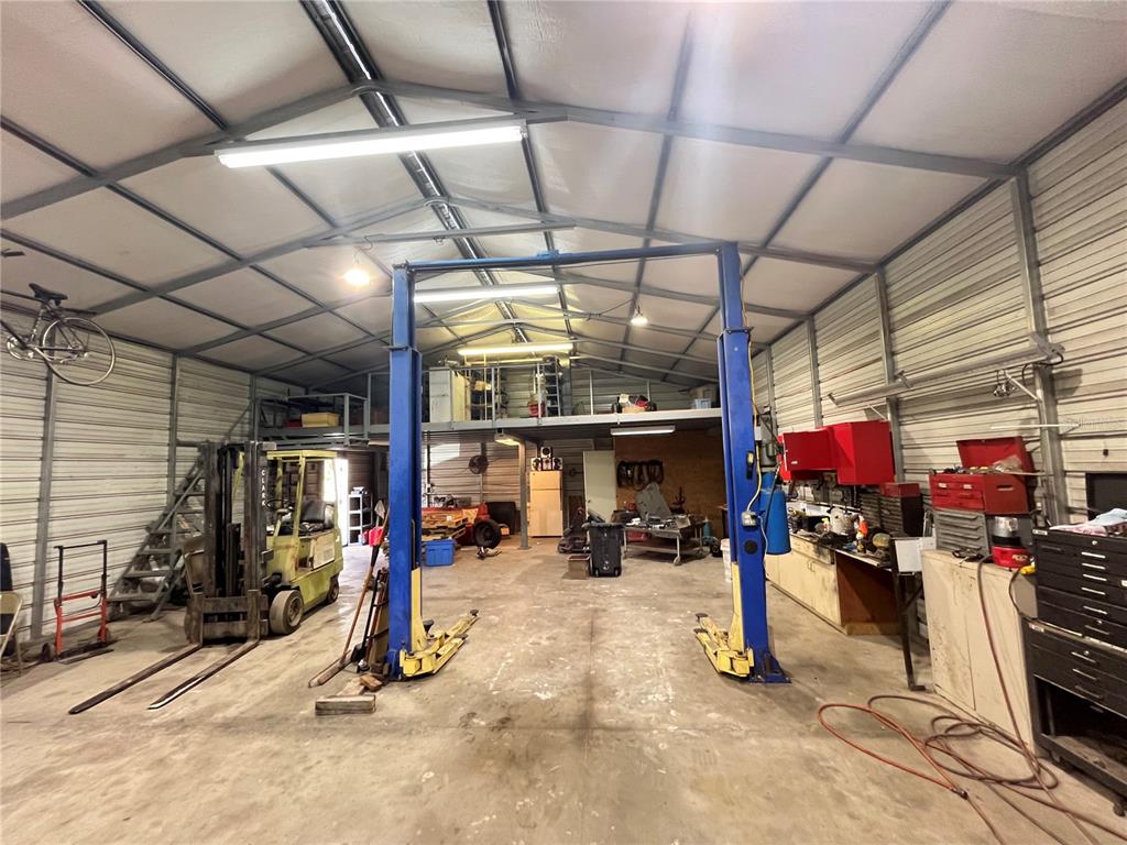 820 Chicken Farm Road Osteen, FL 32764 - Photo 8 of 30 a view of a room with gym equipment