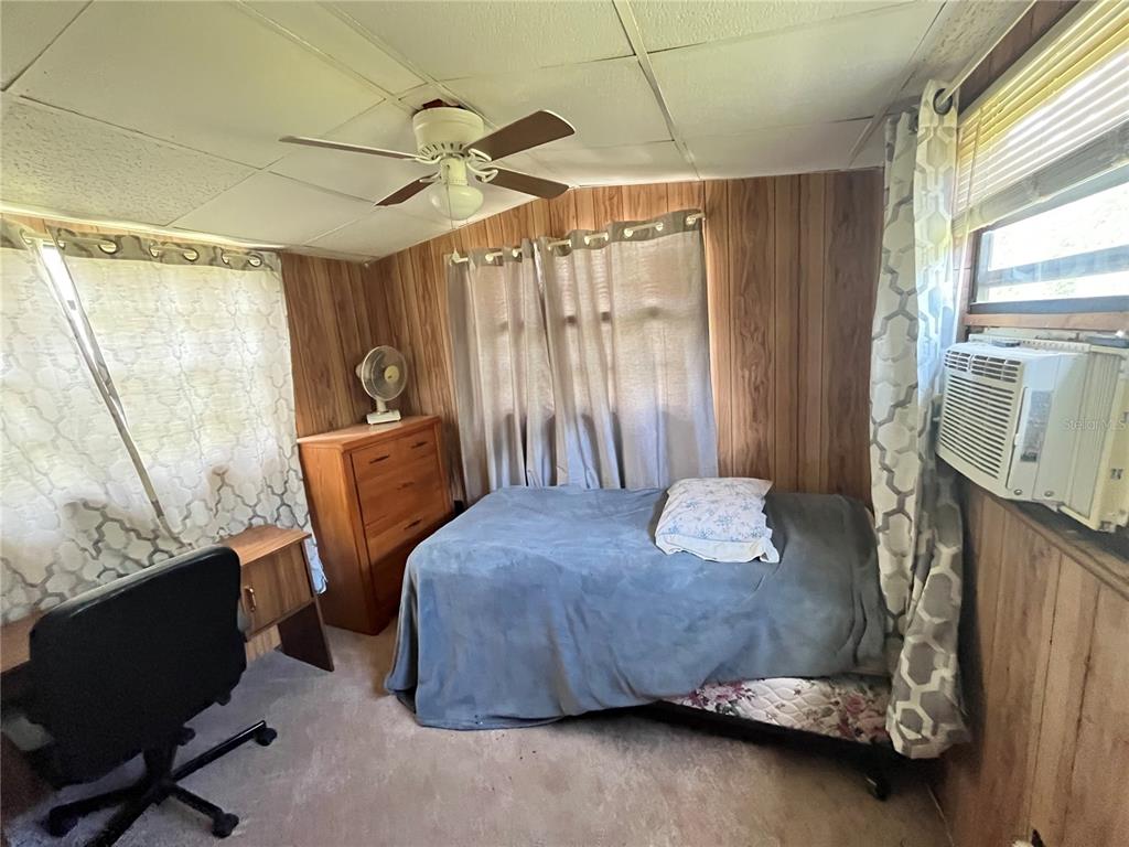 820 Chicken Farm Road Osteen, FL 32764 - Photo 10 of 30 a bedroom with a bed and a window