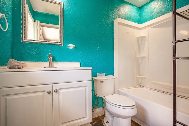 a bathroom with a shower and a toilet
