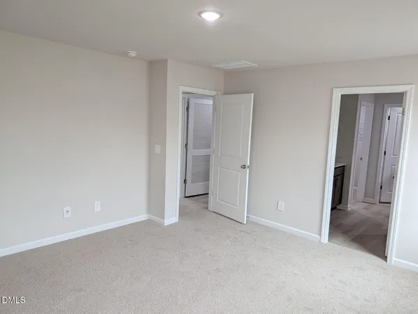 a view of empty room with windows