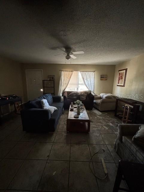 3538 Pinetree Street Port Charlotte, FL 33952 - Photo 14 of 28 a living room with furniture and a large window