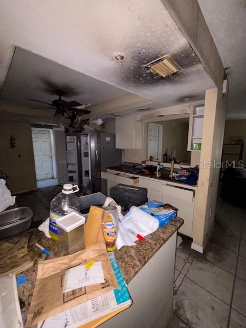 3538 Pinetree Street Port Charlotte, FL 33952 - Photo 19 of 28 a living room with granite countertop furniture and a view of kitchen