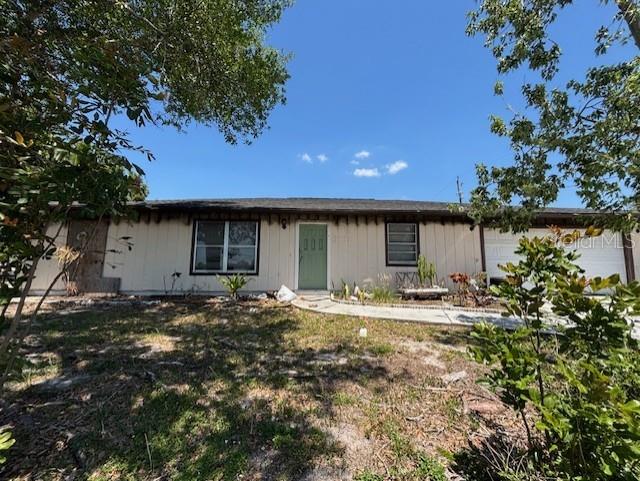 3538 Pinetree Street Port Charlotte, FL 33952 - Photo 2 of 28 a house view with a sitting space and garden