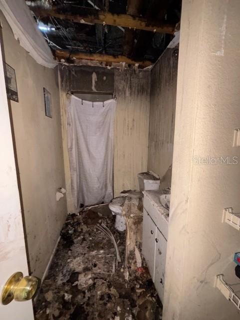 3538 Pinetree Street Port Charlotte, FL 33952 - Photo 22 of 28 a bathroom with a sink toilet and shower