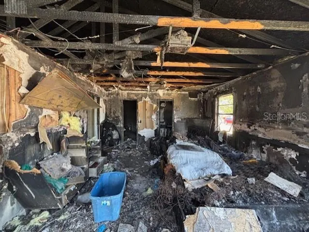 a view of a patio with table and chairs barbeque with potted plants