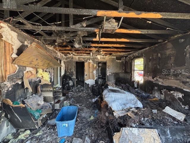 3538 Pinetree Street Port Charlotte, FL 33952 - Photo 23 of 28 a view of a patio with table and chairs barbeque with potted plants