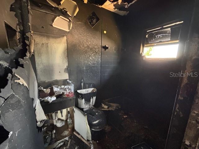 3538 Pinetree Street Port Charlotte, FL 33952 - Photo 25 of 28 a living room with furniture and a window