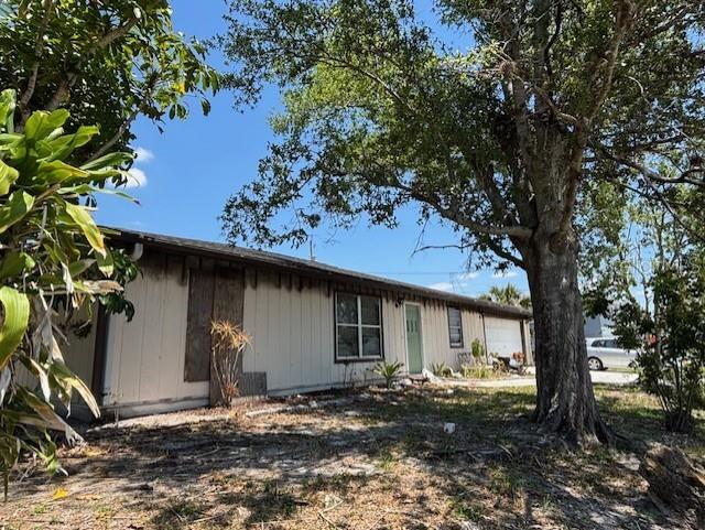 3538 Pinetree Street Port Charlotte, FL 33952 - Photo 3 of 28 a front view of a house with garden