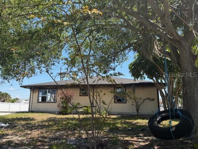 3538 Pinetree Street Port Charlotte, FL 33952 - Photo 4 of 28 a front view of a house with a yard