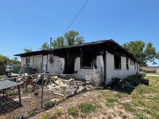 a house with trees in the background