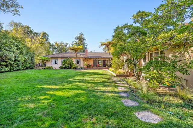 a view of a house with a big yard