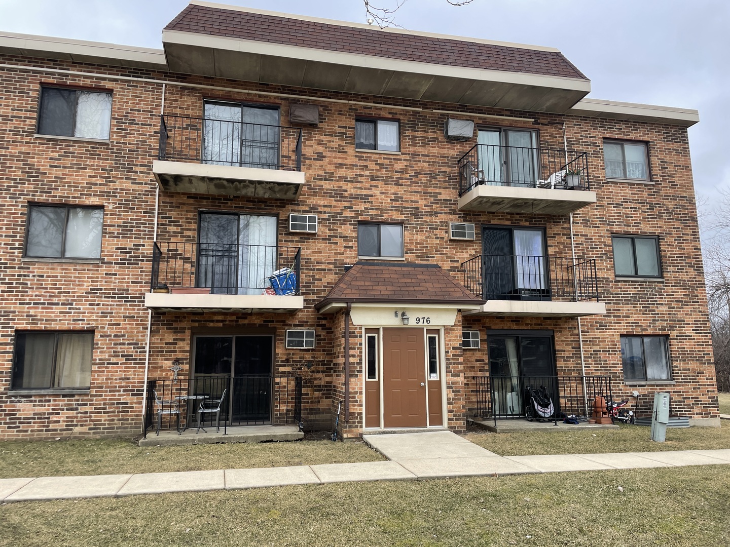 976 North Rohlwing Road, Unit GA Addison, IL 60101 - Photo 1 of 20 a front view of a house with a yard