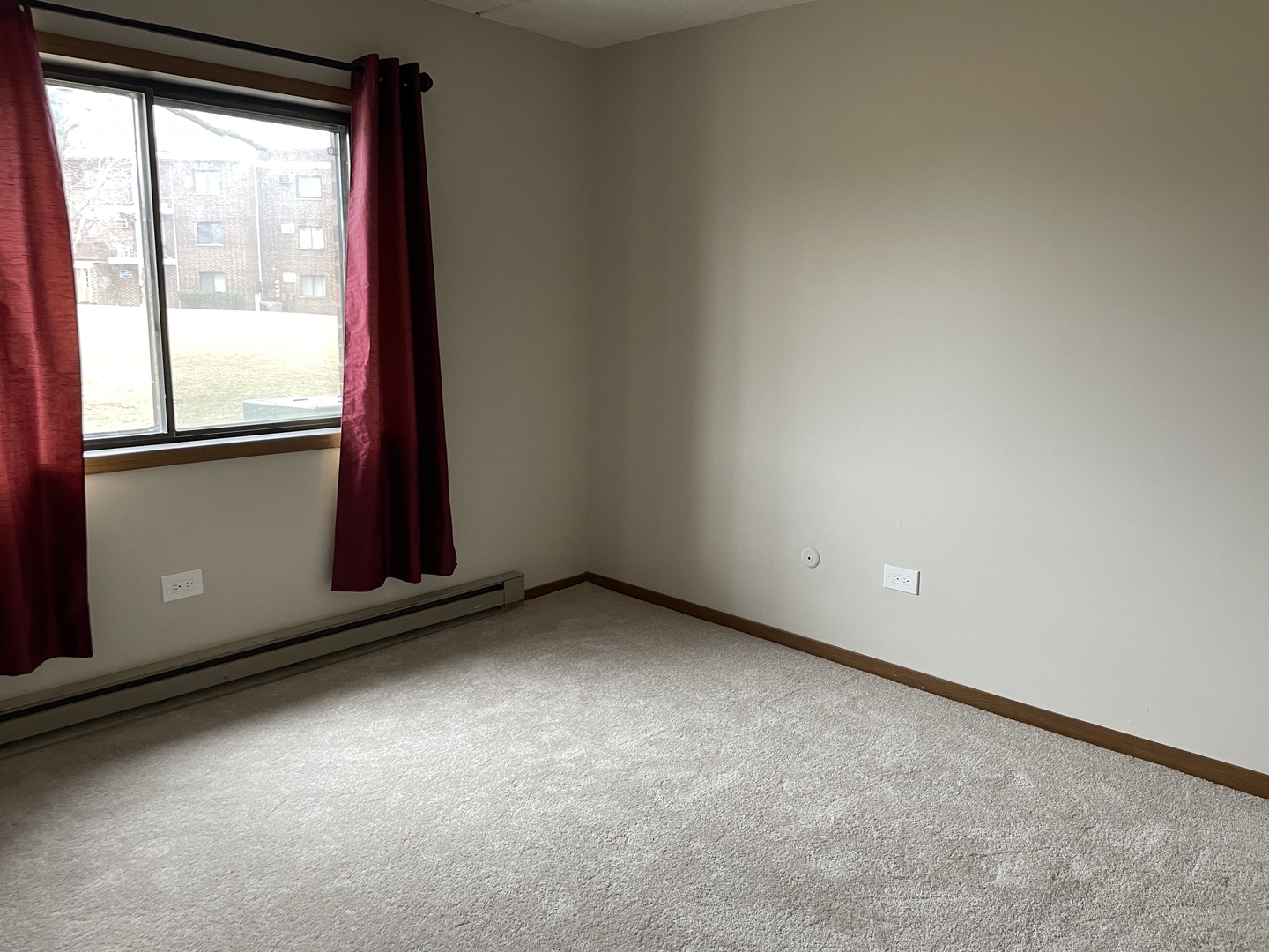 976 North Rohlwing Road, Unit GA Addison, IL 60101 - Photo 11 of 20 a view of an empty room with a window