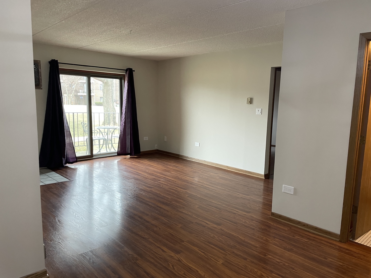 976 North Rohlwing Road, Unit GA Addison, IL 60101 - Photo 15 of 20 an empty room with wooden floor and windows