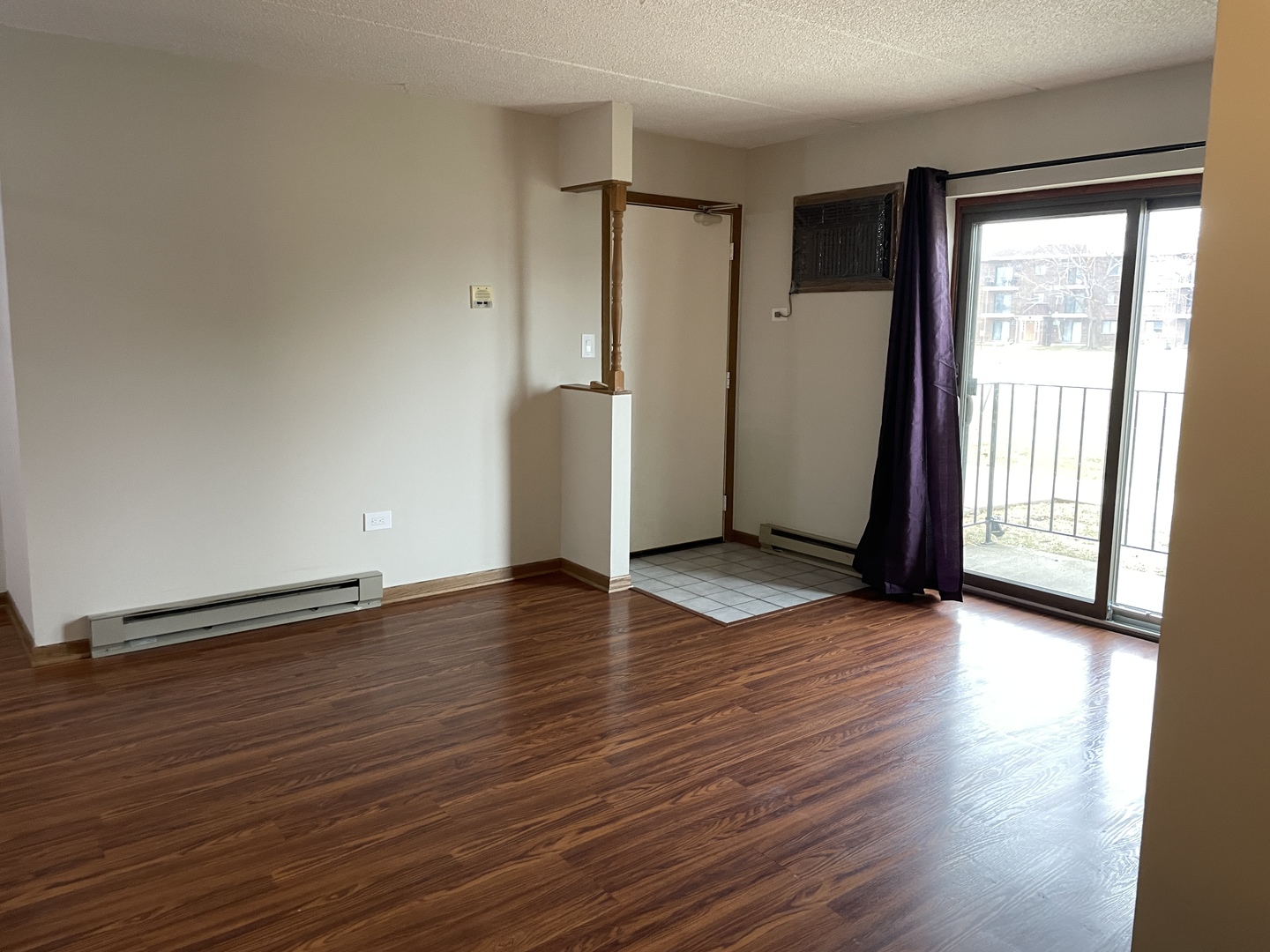 976 North Rohlwing Road, Unit GA Addison, IL 60101 - Photo 3 of 20 an empty room with wooden floor and windows