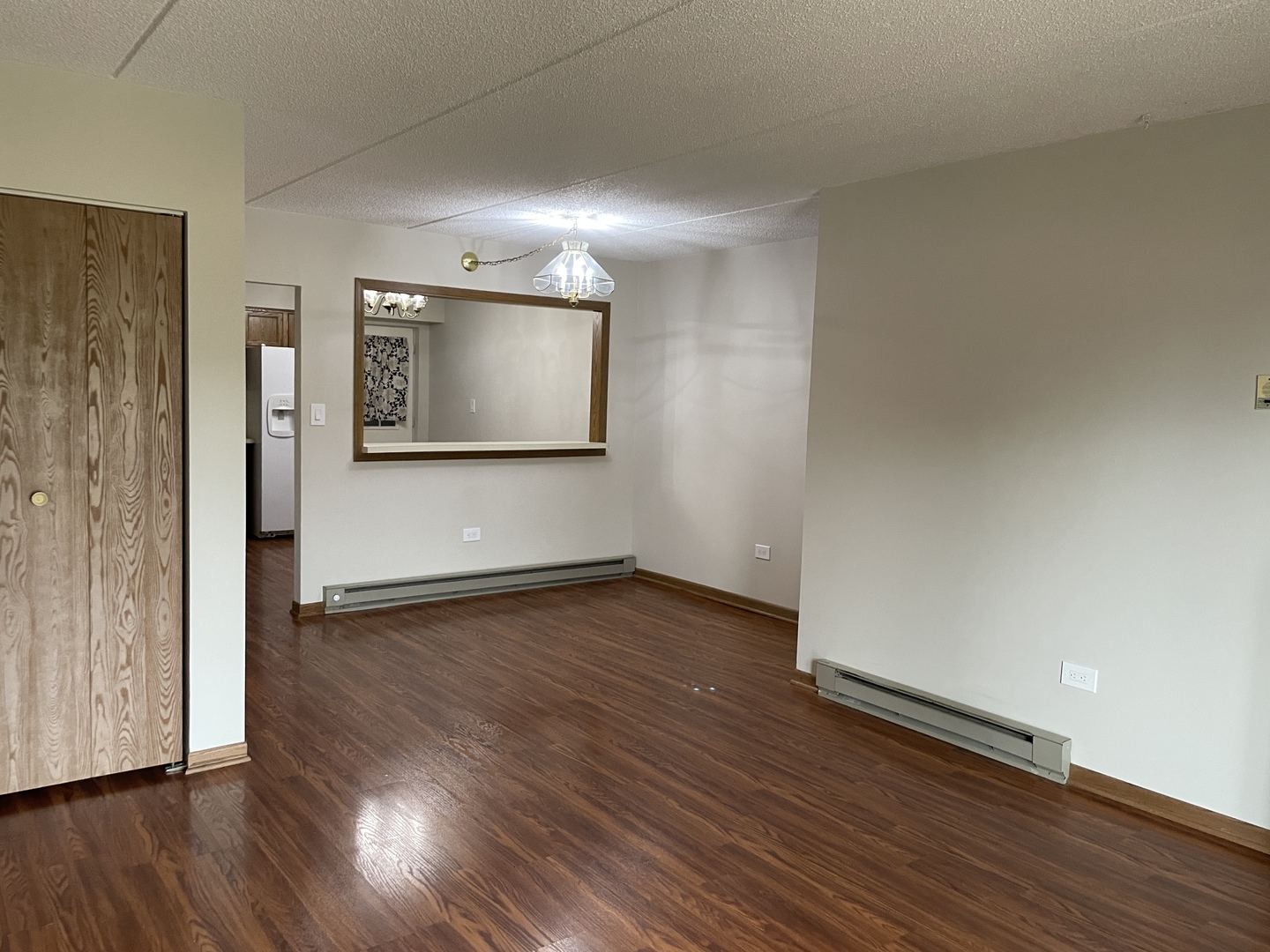 976 North Rohlwing Road, Unit GA Addison, IL 60101 - Photo 4 of 20 a view of an empty room with wooden floor