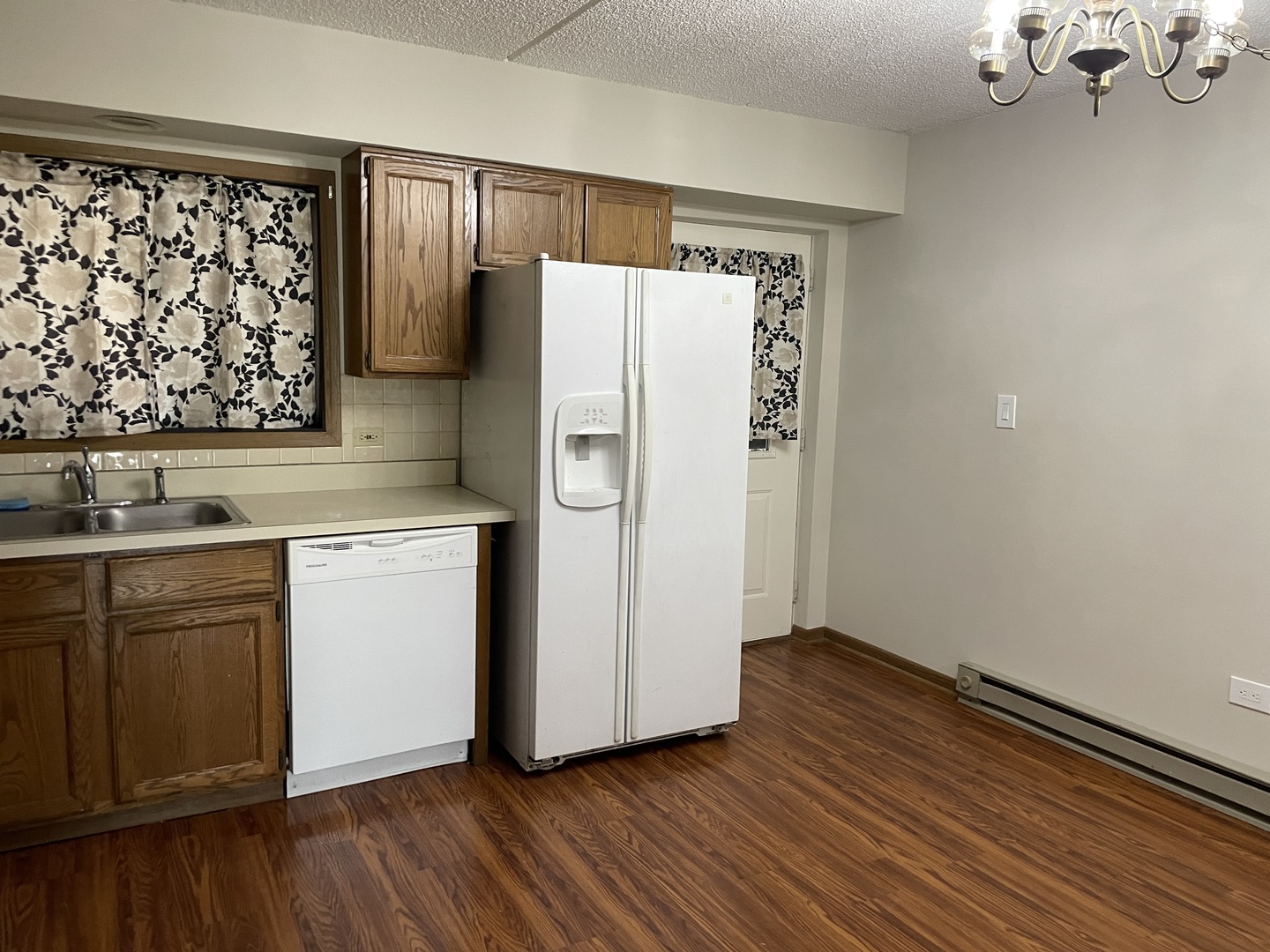 976 North Rohlwing Road, Unit GA Addison, IL 60101 - Photo 8 of 20 a kitchen with a refrigerator sink and cabinets