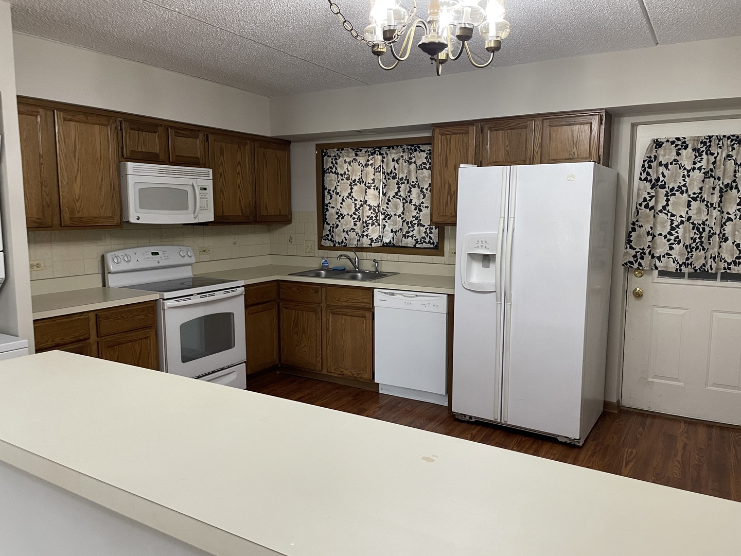 976 North Rohlwing Road, Unit GA Addison, IL 60101 - Photo 9 of 20 a kitchen with stainless steel appliances a refrigerator sink and stove