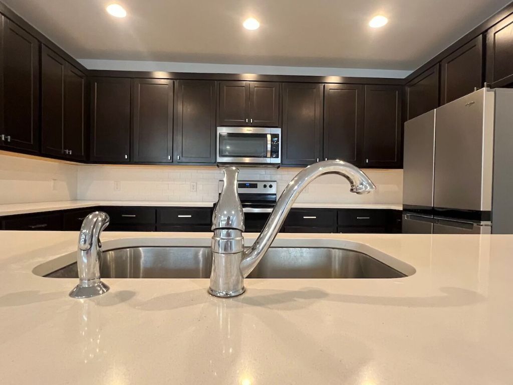 124 Old Stagecoach Road Jarrell, TX 76537 - Photo 11 of 40 a kitchen with a sink and stainless steel appliances