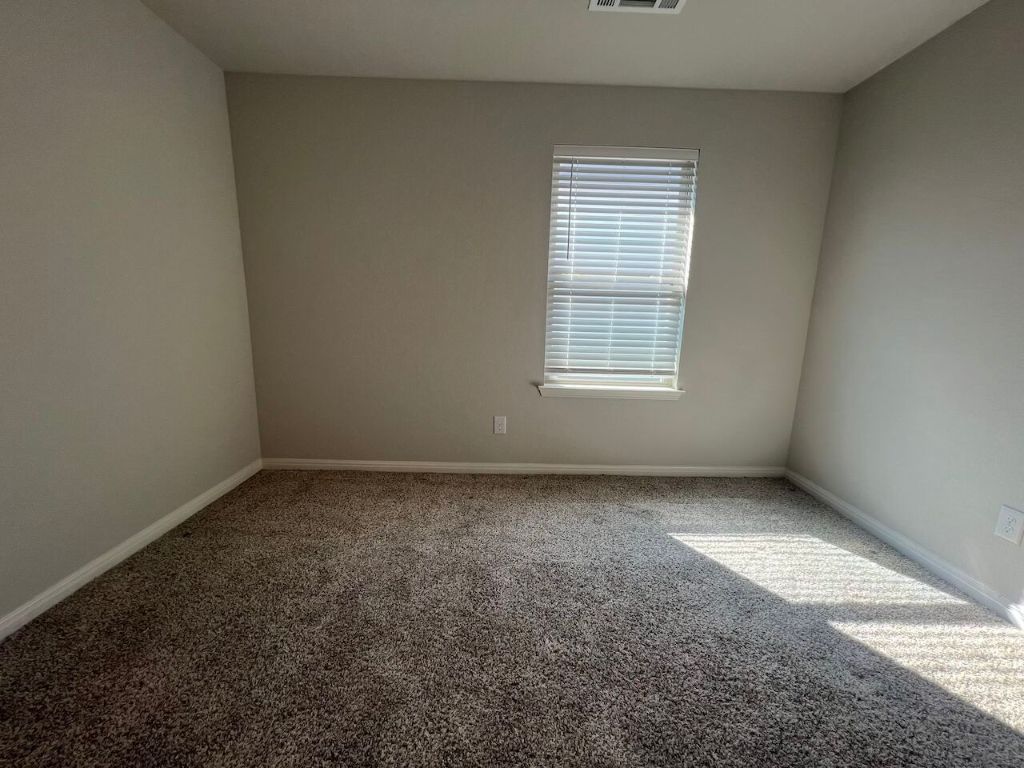 124 Old Stagecoach Road Jarrell, TX 76537 - Photo 13 of 40 an empty room with a window