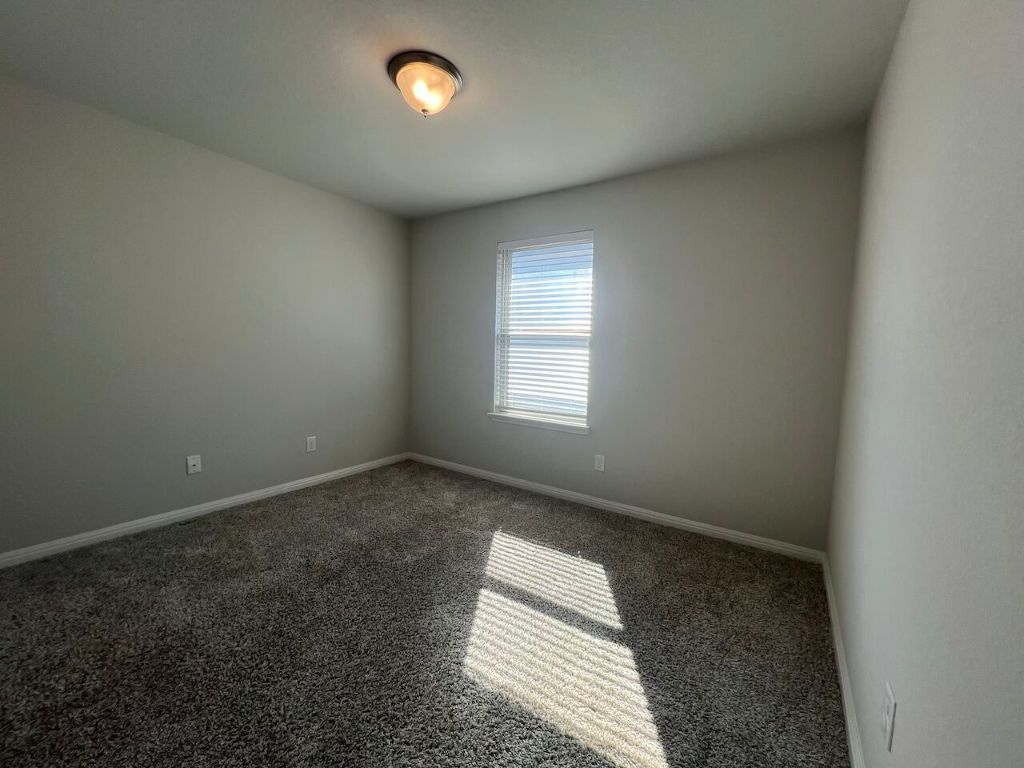 124 Old Stagecoach Road Jarrell, TX 76537 - Photo 17 of 40 an empty room with a window