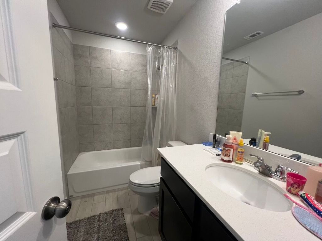 124 Old Stagecoach Road Jarrell, TX 76537 - Photo 19 of 40 a bathroom with a sink toilet and shower