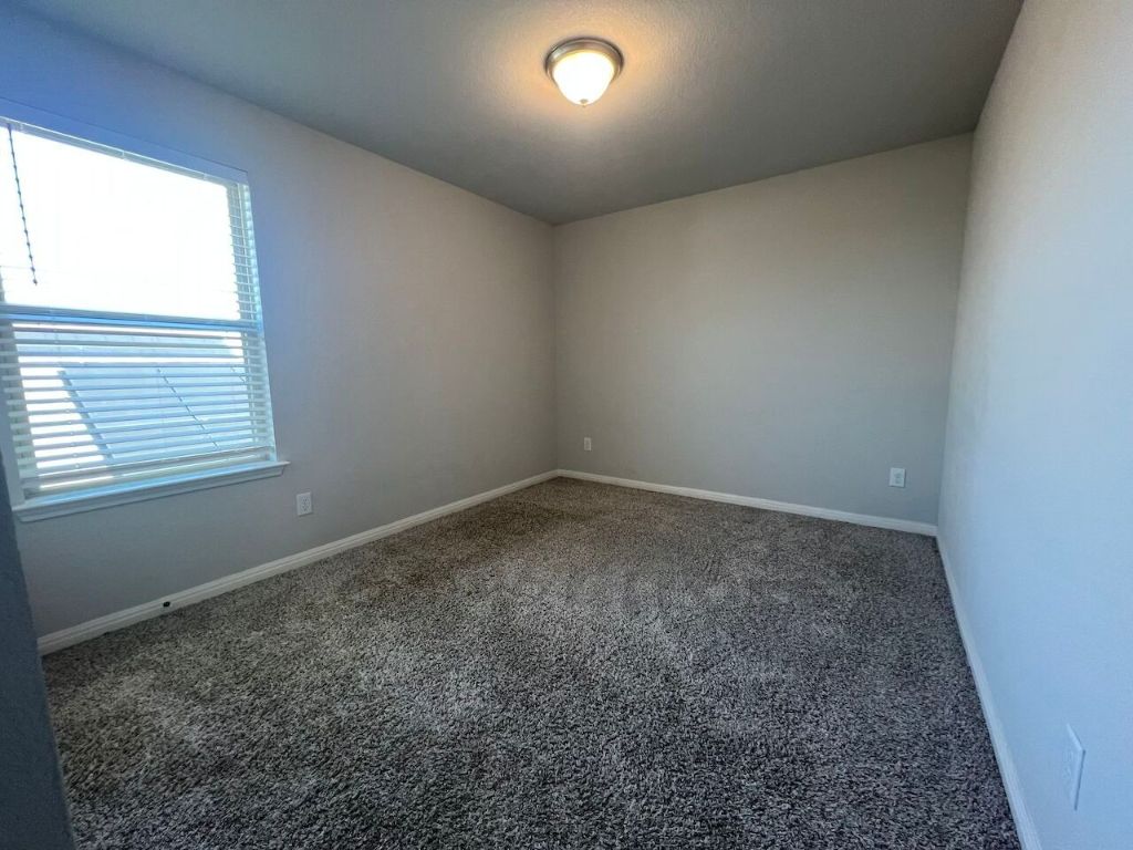 124 Old Stagecoach Road Jarrell, TX 76537 - Photo 21 of 40 an empty room with a window