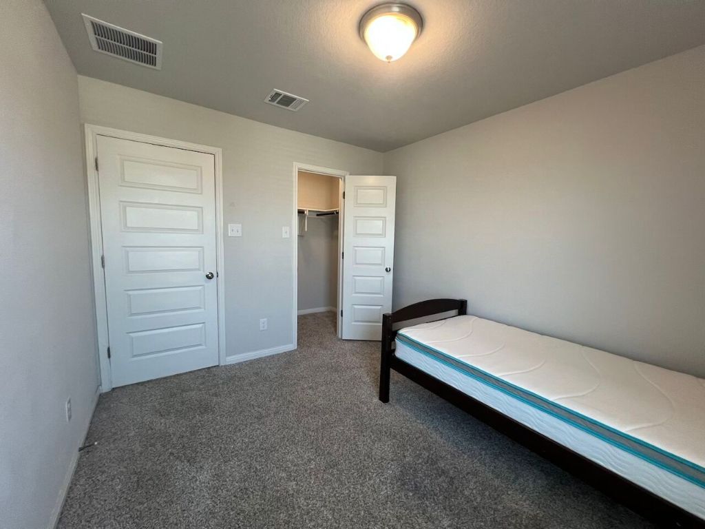 124 Old Stagecoach Road Jarrell, TX 76537 - Photo 25 of 40 a room with a dresser