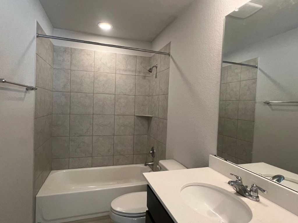 124 Old Stagecoach Road Jarrell, TX 76537 - Photo 26 of 40 a bathroom with a sink toilet and shower