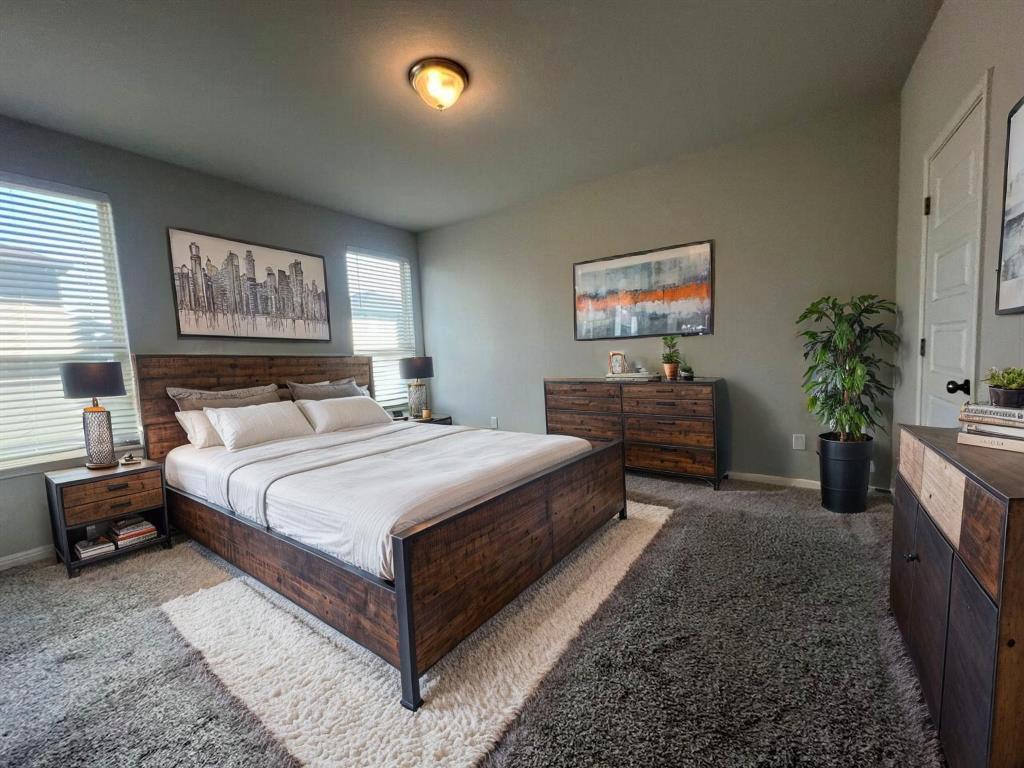 124 Old Stagecoach Road Jarrell, TX 76537 - Photo 29 of 40 a bedroom with a large bed and a couch