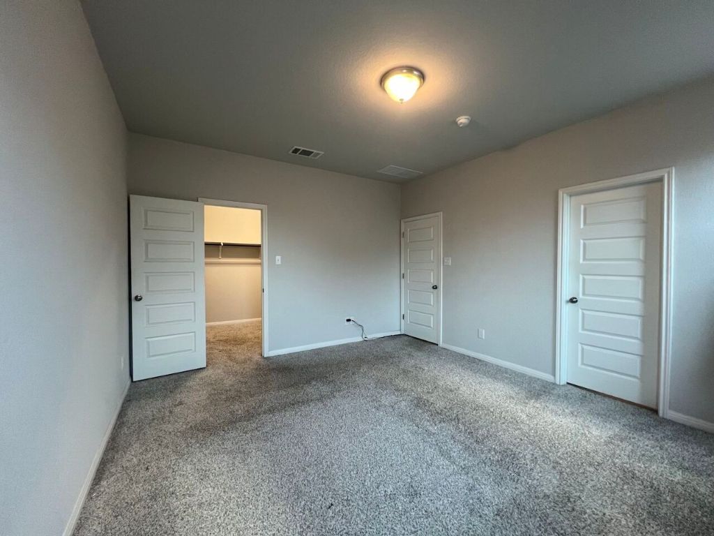 124 Old Stagecoach Road Jarrell, TX 76537 - Photo 31 of 40 an empty room with a empty space and windows