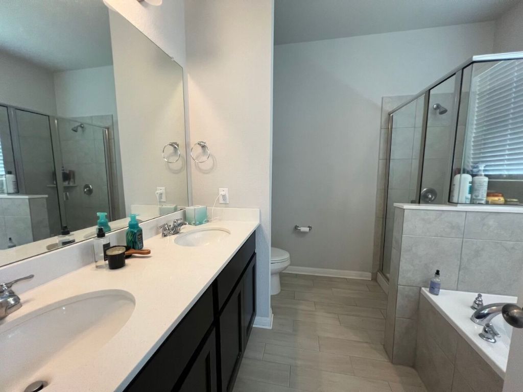 124 Old Stagecoach Road Jarrell, TX 76537 - Photo 33 of 40 a bathroom with a double vanity sink mirror and double