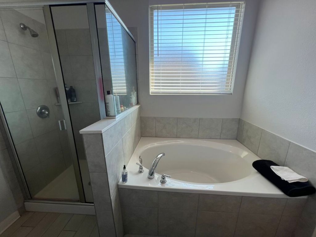 124 Old Stagecoach Road Jarrell, TX 76537 - Photo 34 of 40 a bath tub sitting in a bathroom next to a window