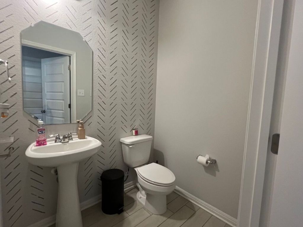 124 Old Stagecoach Road Jarrell, TX 76537 - Photo 35 of 40 a bathroom with a sink and a toilet