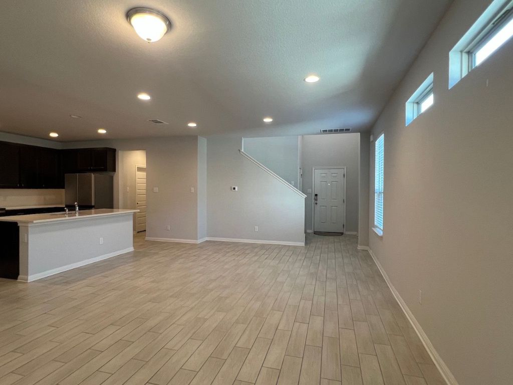 124 Old Stagecoach Road Jarrell, TX 76537 - Photo 7 of 40 a view of an empty room with kitchen