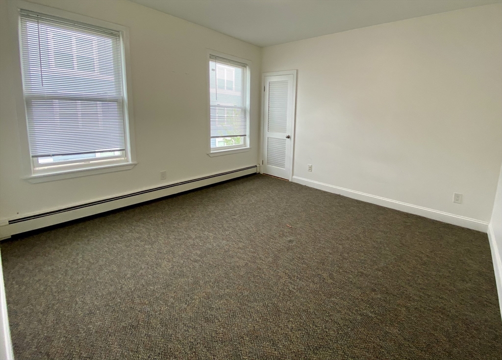 21 Heldun Street, Unit 2 Boston, MA 02132 - Photo 11 of 19 an empty room with a window