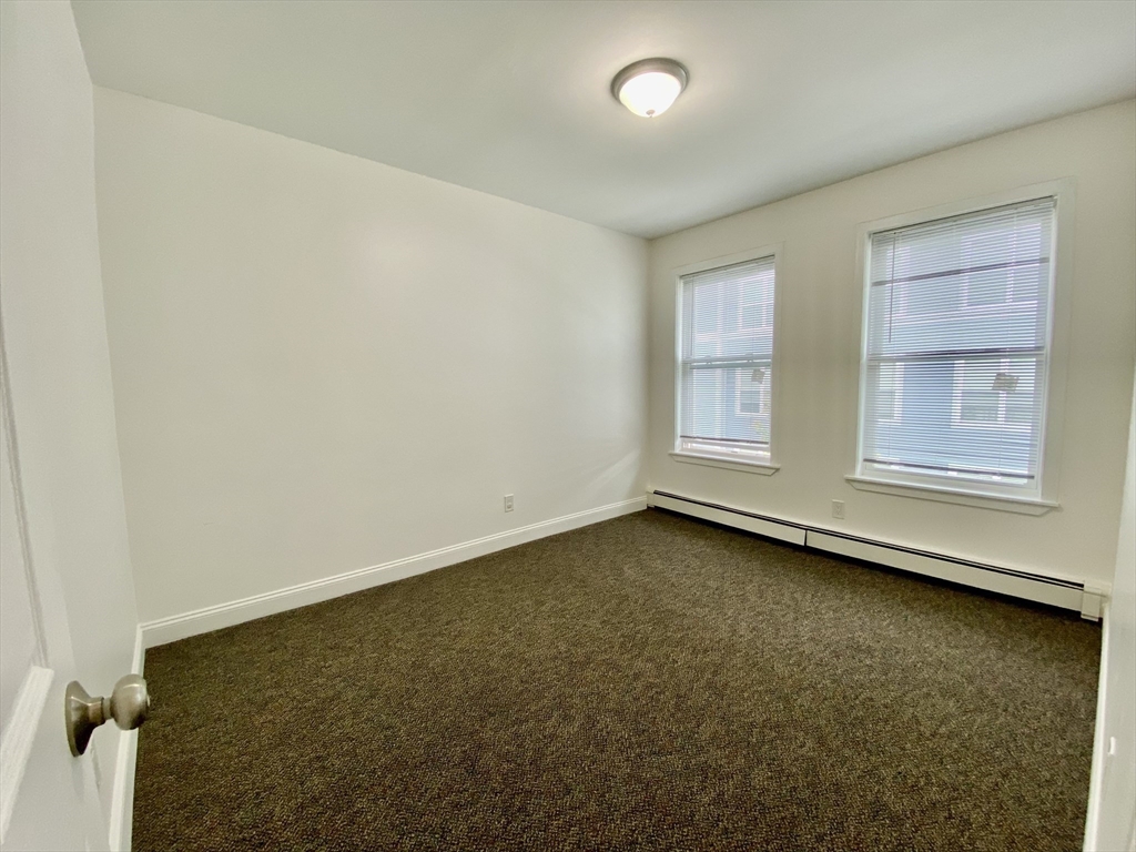 21 Heldun Street, Unit 2 Boston, MA 02132 - Photo 12 of 19 an empty room with a window
